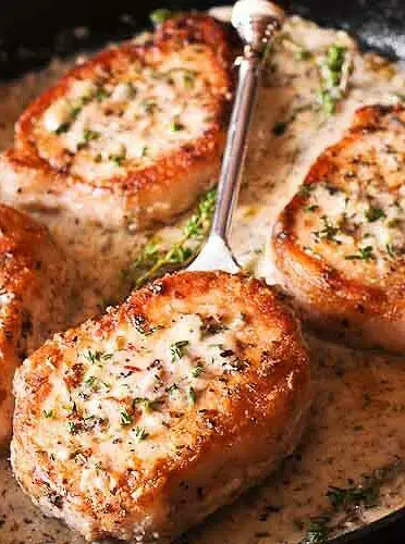 Boneless Pork Chops in Creamy Garlic and Herb Wine Sauce