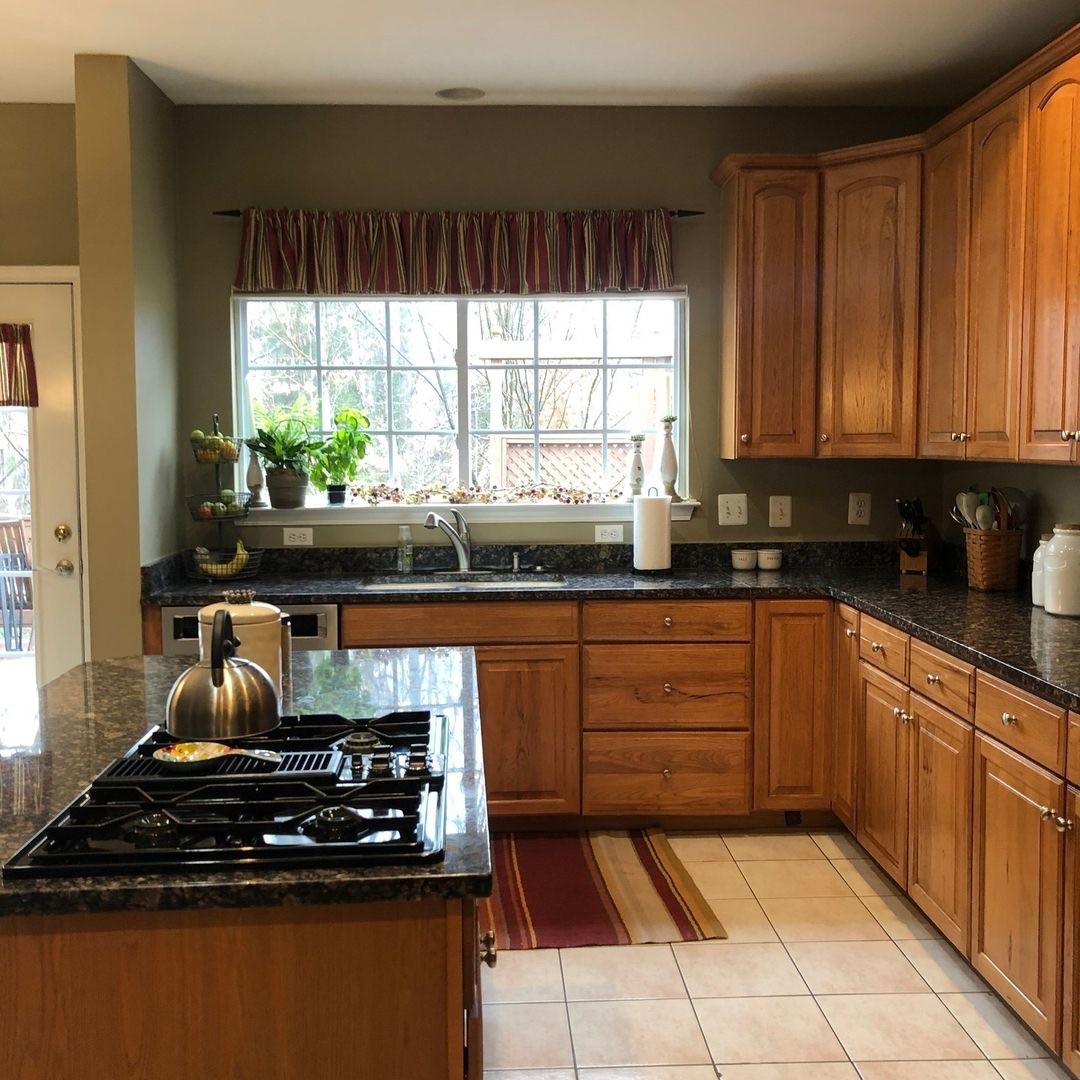 BEFORE: DATED KITCHEN WITH DINGY CABINETS