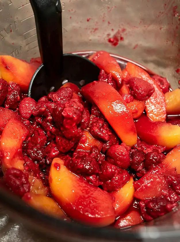 Dutch Oven Peach Raspberry Cobbler