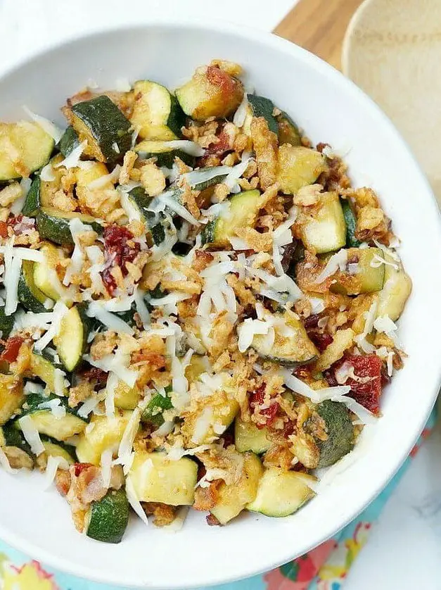 Zucchini with Sun Dried Tomatoes, Bacon, and Crispy Onions