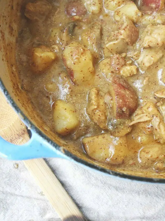 Dutch Oven Smothered Chicken and Potatoes