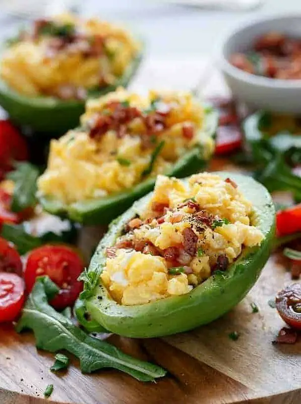 Cheesy Scrambled Eggs in Avocado